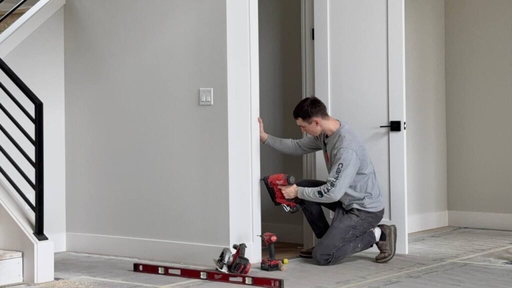 Installing casing for the door for a millwork project in seattle