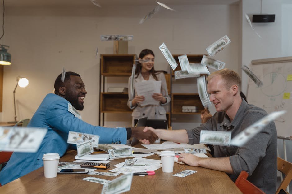 A lively office meeting with colleagues and money flying around, depicting success and finance.