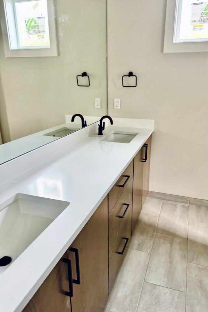 New countertop and cabinets, sleek design, modern look. Done by NickR Remodeling for a bathroom remodeling in Seattle