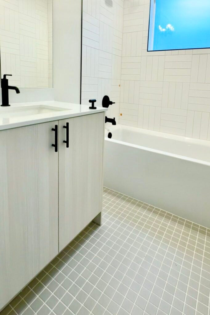 Updated tile, bath and cabinets for a bathroom remodeling in seattle.