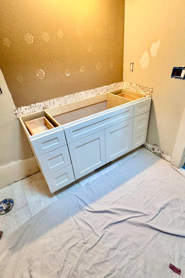 Process of bathroom remodeling for Seattle's project. New cabinets and patching.