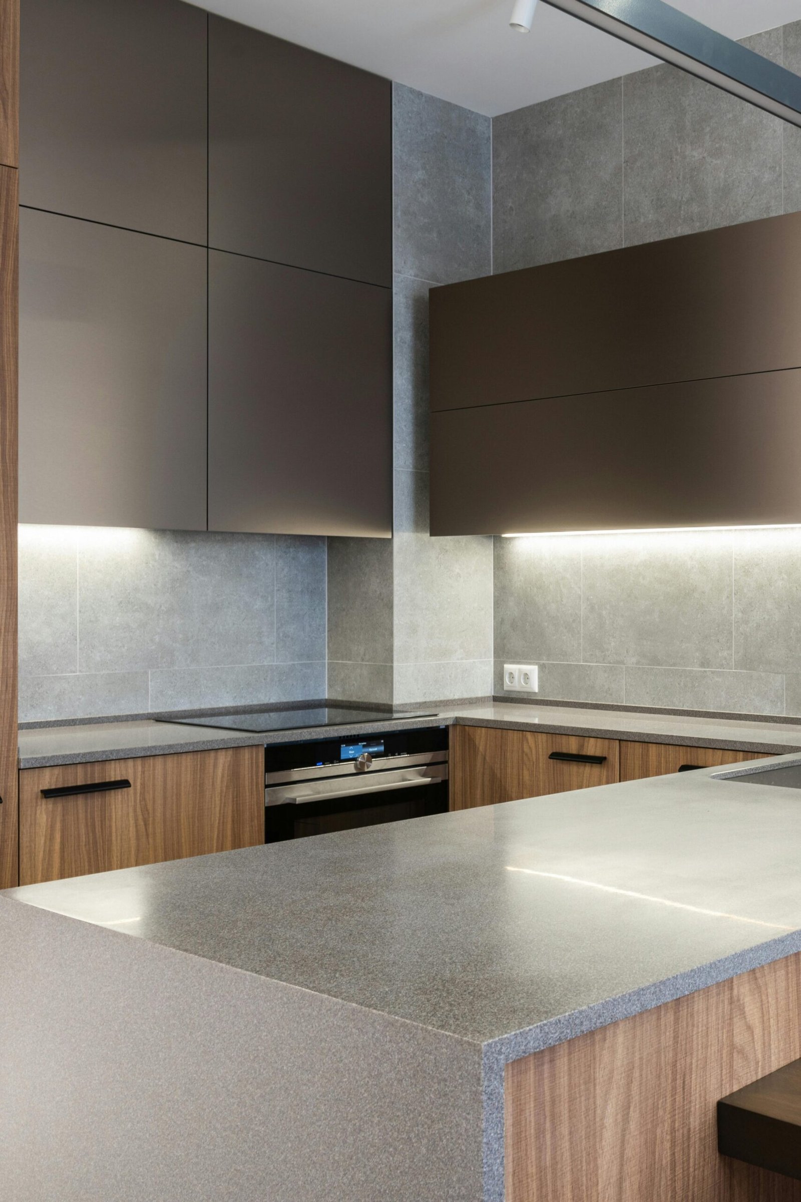 Sleek and modern kitchen with contemporary appliances and wooden cabinetry.